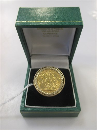 Lot 210 - A 9ct gold ring containing a 1914 full...