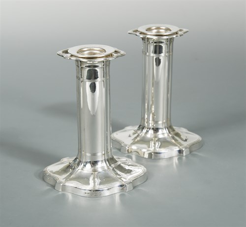 Lot 93 - A pair of Edward VII silver candlesticks