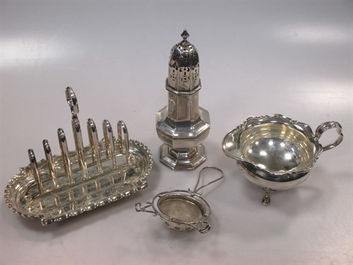 Lot 261 - A silver toastrack, a silver cream jug, a...