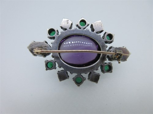 Lot 445 - An Arts and Crafts amethyst, moonstone and chrysoprase brooch, formerly with the Tadema Gallery