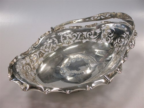 Lot 269 - A silver pierced swing handled bread basket,...