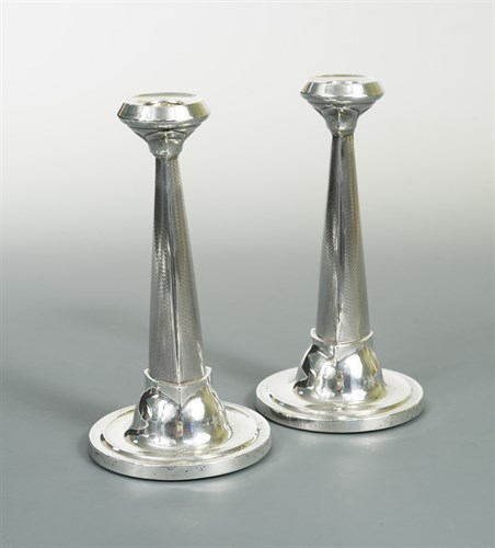 Lot 112 - A pair of  George V silver candlesticks
