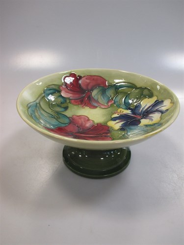 Lot 26 - A Moorcroft comport decorated with Hibiscus...