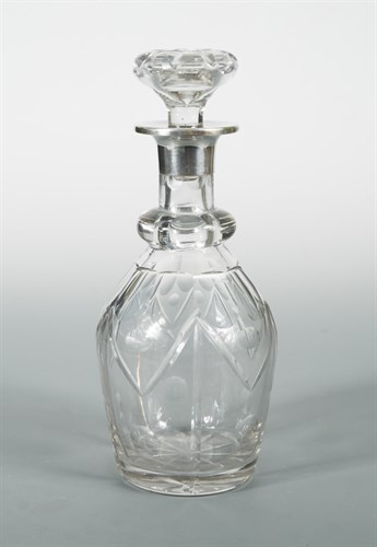 Lot 124 - A George V cut glass decanter with silver collar