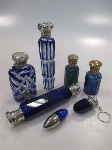 Lot 183 - A collection of blue glass scent bottles...