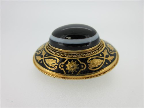 Lot 274 - A Victorian banded agate and enamel brooch