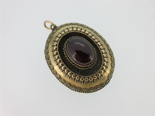 Lot 268 - A Victorian garnet cabochon pendant and a similar period cameo brooch with classical scene