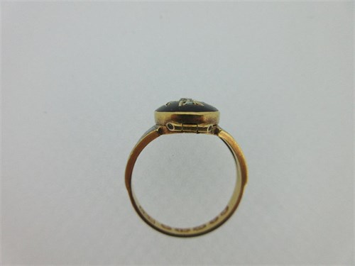 Lot 281 - An 1870 diamond and enamel memorial ring with hinged compartment