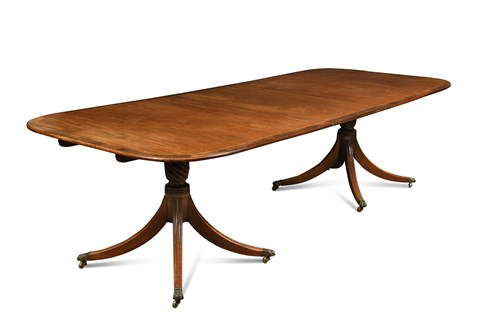 Lot 573 - A George III style mahogany twin pedestal dining table