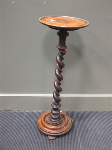 Lot 490 - A 19th century walnut torchere 71cm high