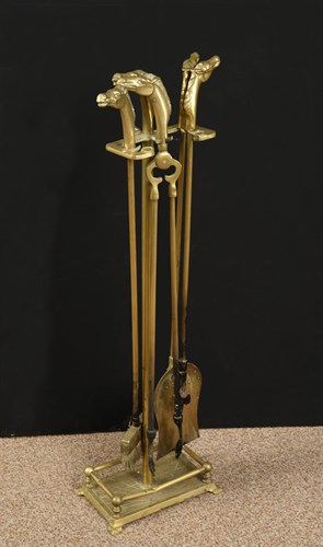 Lot 106 - Brass companion set of fire irons with horse...