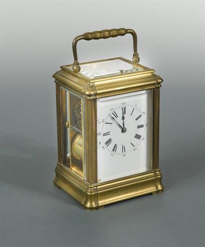 Lot 497 - A French brass repeating carriage clock by Henri Jacot