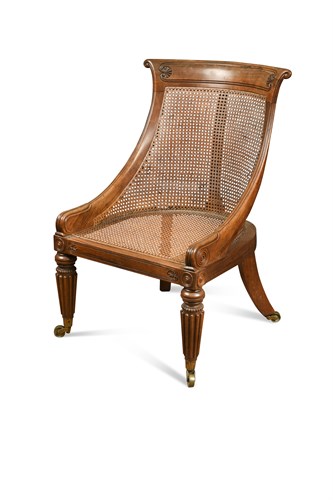 Lot 607 - A Regency rosewood bergere library chair