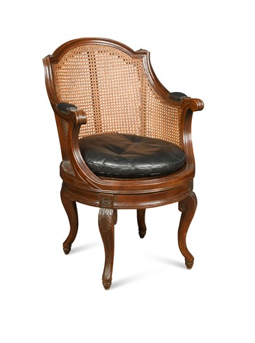 Lot 663 - A Bergere style revolving desk chair