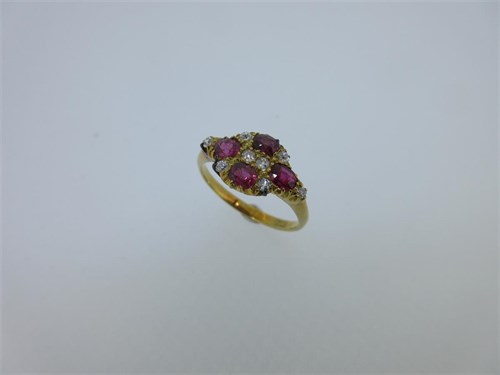 Lot 195 - A pink sapphire and diamond quatrefoil ring