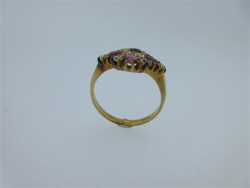 Lot 195 - A pink sapphire and diamond quatrefoil ring
