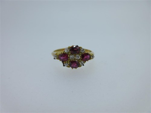 Lot 195 - A pink sapphire and diamond quatrefoil ring