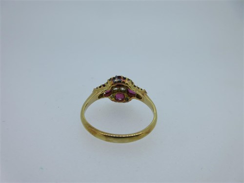 Lot 195 - A pink sapphire and diamond quatrefoil ring