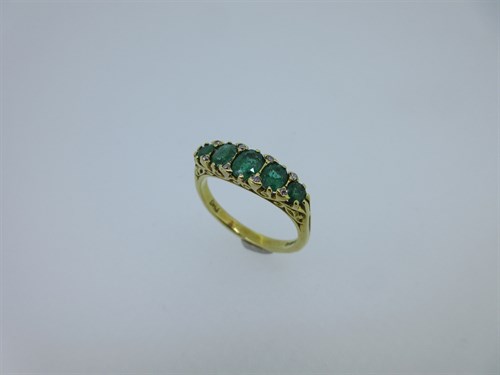 Lot 234 - An Edwardian style emerald, diamond and 18ct gold ring