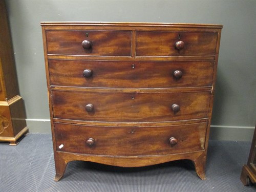 Lot 402 - A 19th century mahogany bow front chest of...
