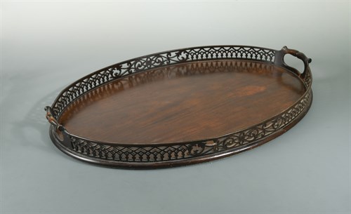 Lot 410 - A George III style figured mahogany oval two handled tray