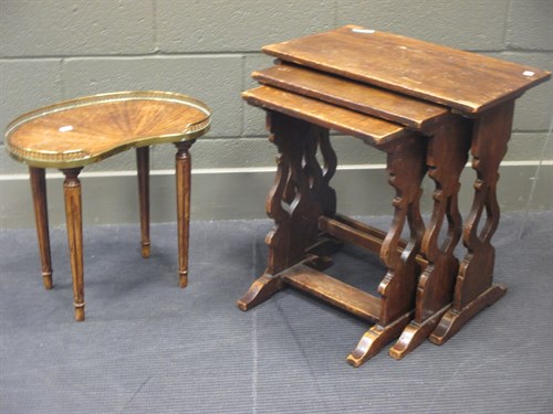 Lot 392 - A nest of three oak tables, an oval mahogany...