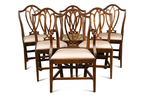 Lot 572 - A set of seven George III ‘Hepplewhite’ dining chairs
