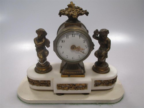 Lot 29 - A French gilt brass and white marble mantel...
