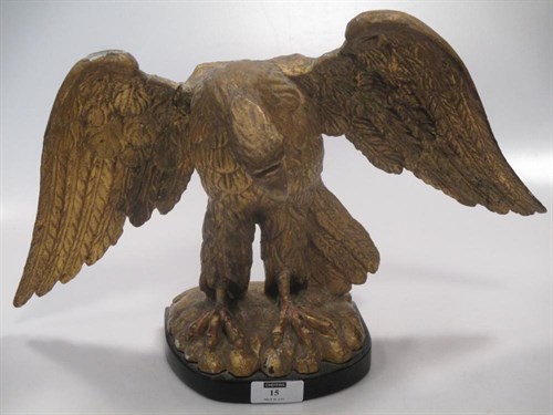 Lot 15 - A Regency carved giltwood wall hanging eagle...