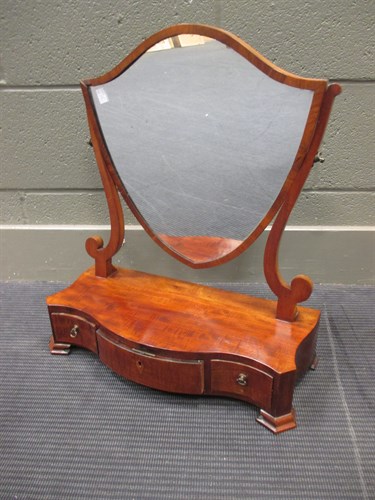 Lot 405 - A George III mahogany serpentine dressing...