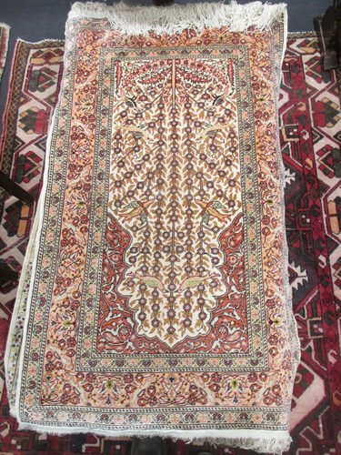 Lot 552 - Two modern Persian silk miniature rugs or mats...