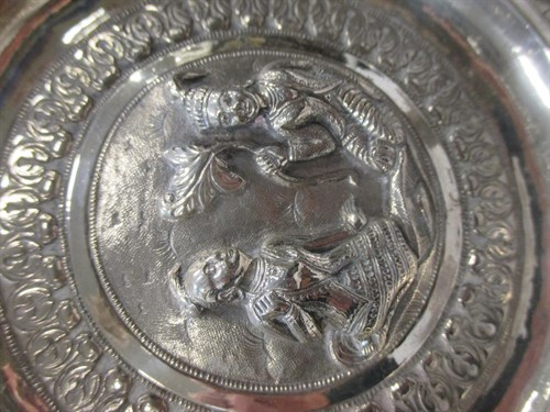 Lot 278 - An Asian silver embossed dish and a small...
