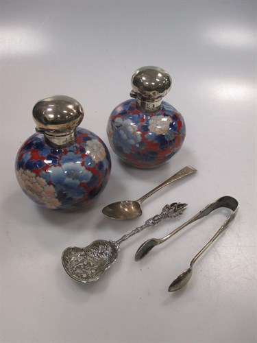 Lot 267 - A pair of silver capped scent bottles (one...