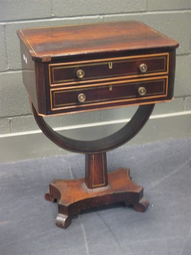 Lot 410 - A Regency rosewood pedestal sewing table