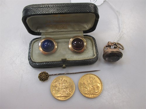 Lot 219 - A flowerhead stick pin marked '15ct' and a fob...
