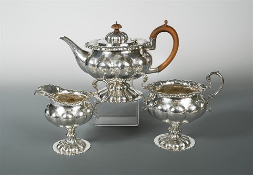 Lot 400 - An Edward VII silver three piece tea set