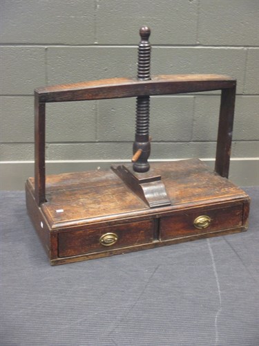 Lot 503 - A 19th century oak table top press with two...