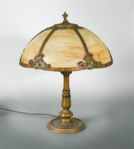 Lot 85 - An early 20th century painted spelter and glass table lamp