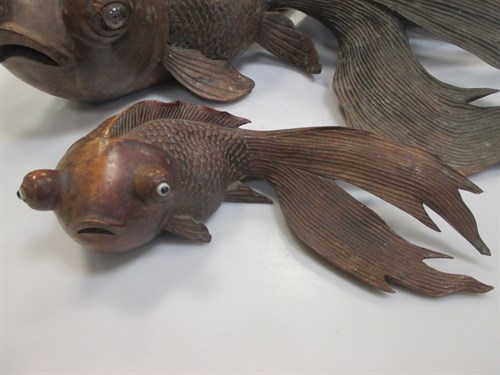 Lot 35 - Two Japanese carved wood Fantail Goldfish, the...