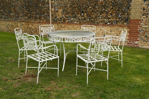 Lot 157 - Attributed to John Salterini, a painted aluminium garden table and six chairs