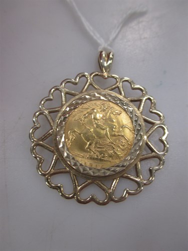 Lot 213 - A 9ct gold pendant containing a George V half...