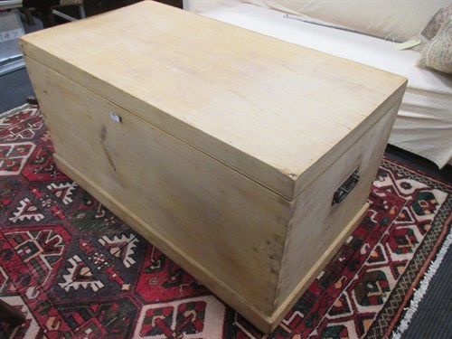 Lot 444 - A large stripped pine blanket box with hinged...