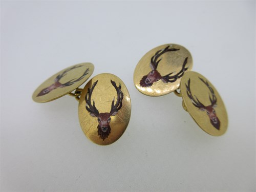 Lot 31 - A pair of stag's head 18ct gold and enamel cufflinks