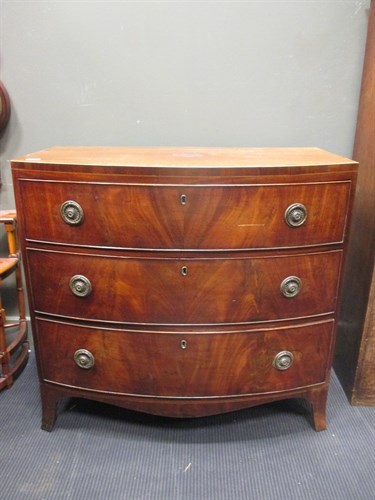 Lot 391 - A Regency mahogany bow front chest of drawers...
