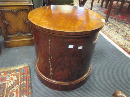 Lot 487 - A 19th century flame mahogany cylindrical commode