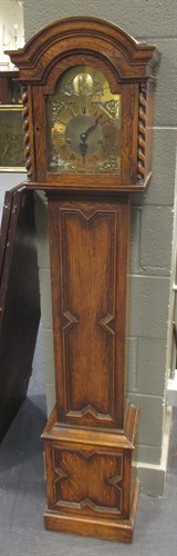Lot 528 - A 1940s oak grandmother clock