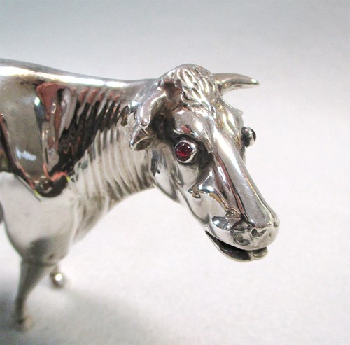 Lot 295 - A 19th century Dutch silver naturalistic cow creamer