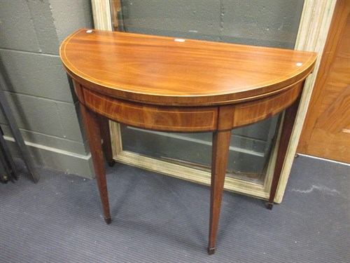Lot 428 - A mahogany demi-lune card table