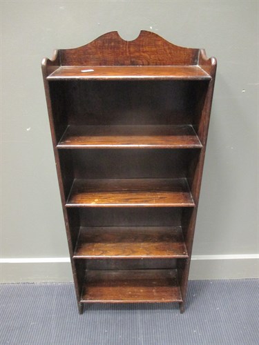 Lot 456 - A Waring and Gillow narrow open front bookcase...