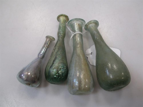 Lot 171 - Four Roman opalescent glass phials, c.10cm (4)